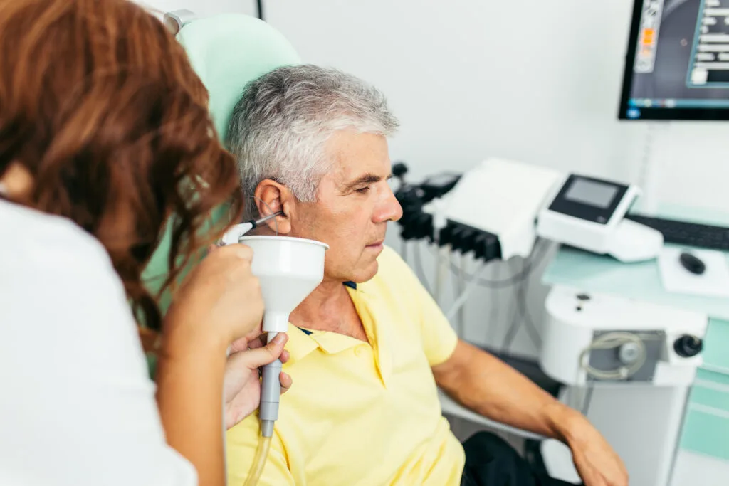 man undergoing a ear wax checkup